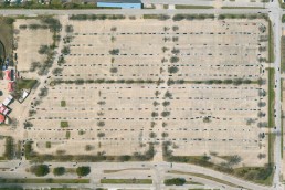 Drivers line up to receive their first dose of Covid vaccine in Fair Park, Dallas, TX